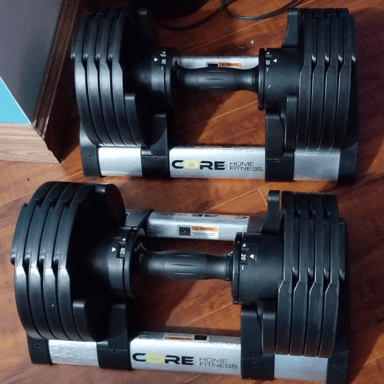 Core Fitness adjustable dumbbells with weight racks